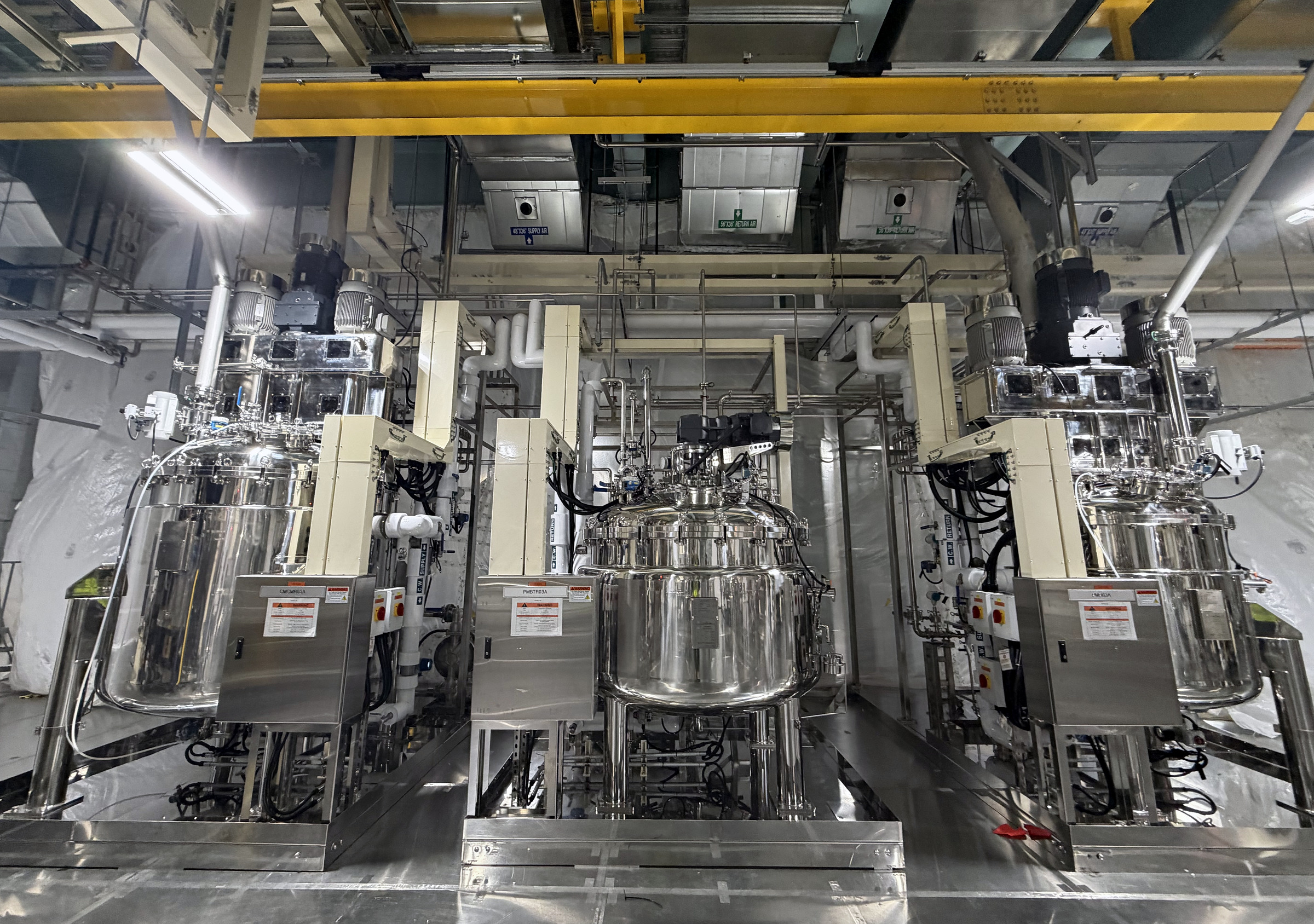 Technical process equipment and utility systems inside a controlled industrial environment.